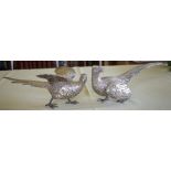 A LOVELY PAIR OF STERLING SILVER TABLE PHEASANTS by F & Son Ltd, well modelled in natural stances. 6