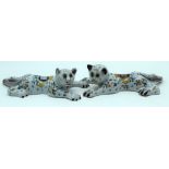 A PAIR OF ANTIQUE FRENCH FAIENCE TIN GLAZED POTTERY CATS painted with flowers. 20 cm x 12 cm.