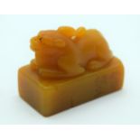 AN EARLY 20TH CENTURY CHINESE CARVED ORANGE SOAPSTONE SEAL Late Qing/Republic, possibly tianhuang. 3