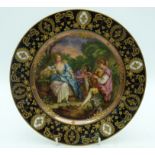 AN EARLY 20TH CENTURY VIENNA PORCELAIN CABINET PLATE painted with three figures within landscapes. 2
