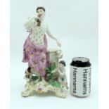 A LARGE 18TH CENTURY MEISSEN PORCELAIN FIGURE OF A STANDING FEMALE modelled smelling flowers upon a