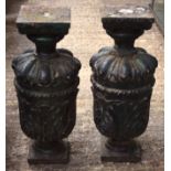 A PAIR OF EARLY 19TH CENTURY PAINTED CAST IRON GARDEN PEDESTALS with floral decoration. 60 cm high.