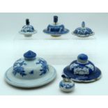 SIX 19TH CENTURY CHINESE BLUE AND WHITE PORCELAIN COVERS Qing, painted with flowers. Largest 15 cm d