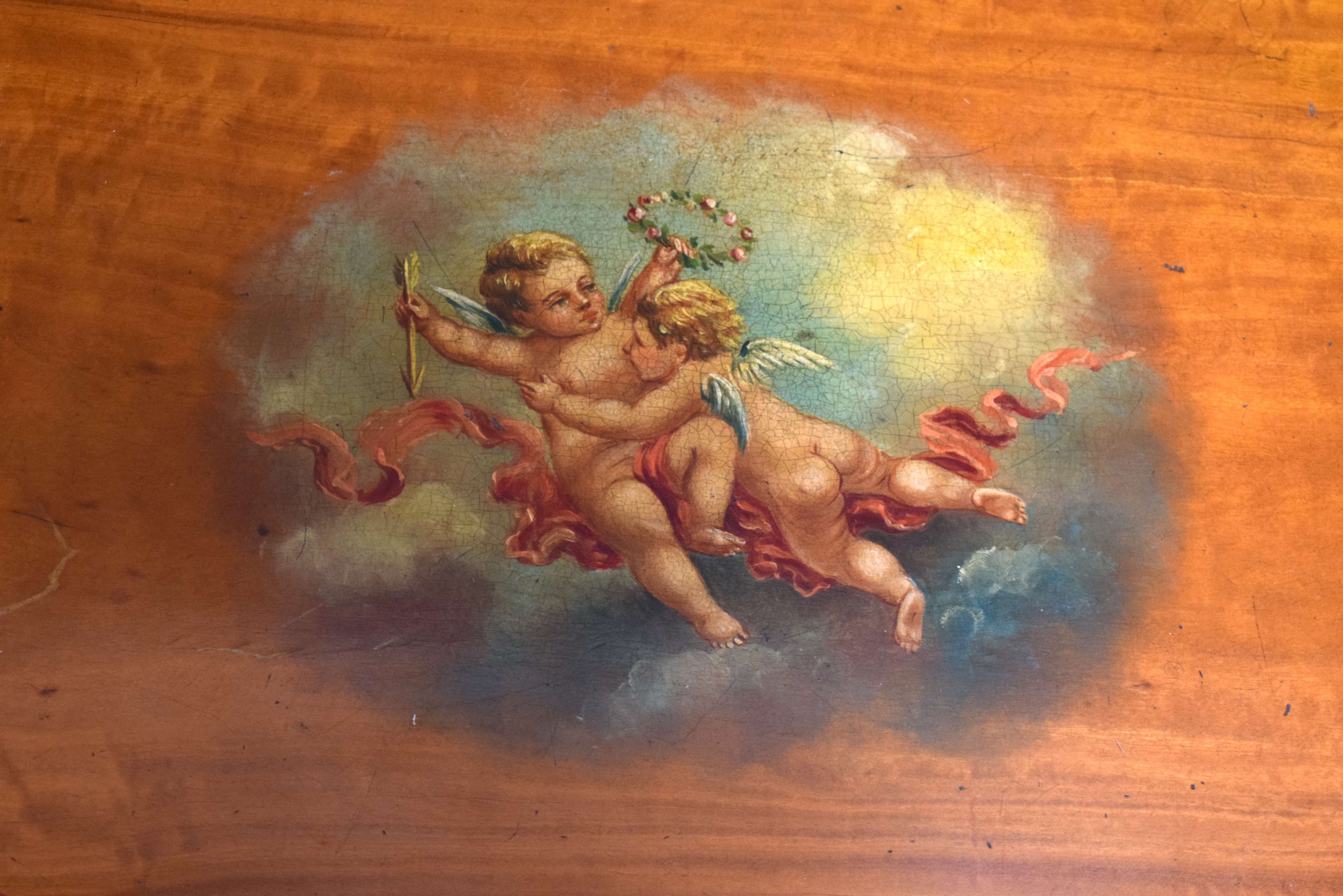 A NEST OF THREE EDWARDIAN PAINTED SATINWOOD TABLES decorated with putti in flight. Largest 57 cm x 6 - Image 4 of 4