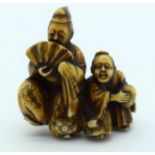 A 19TH CENTURY JAPANESE MEIJI PERIOD CARVED IVORY NETSUKE modelled as a theatrical dancing male besi