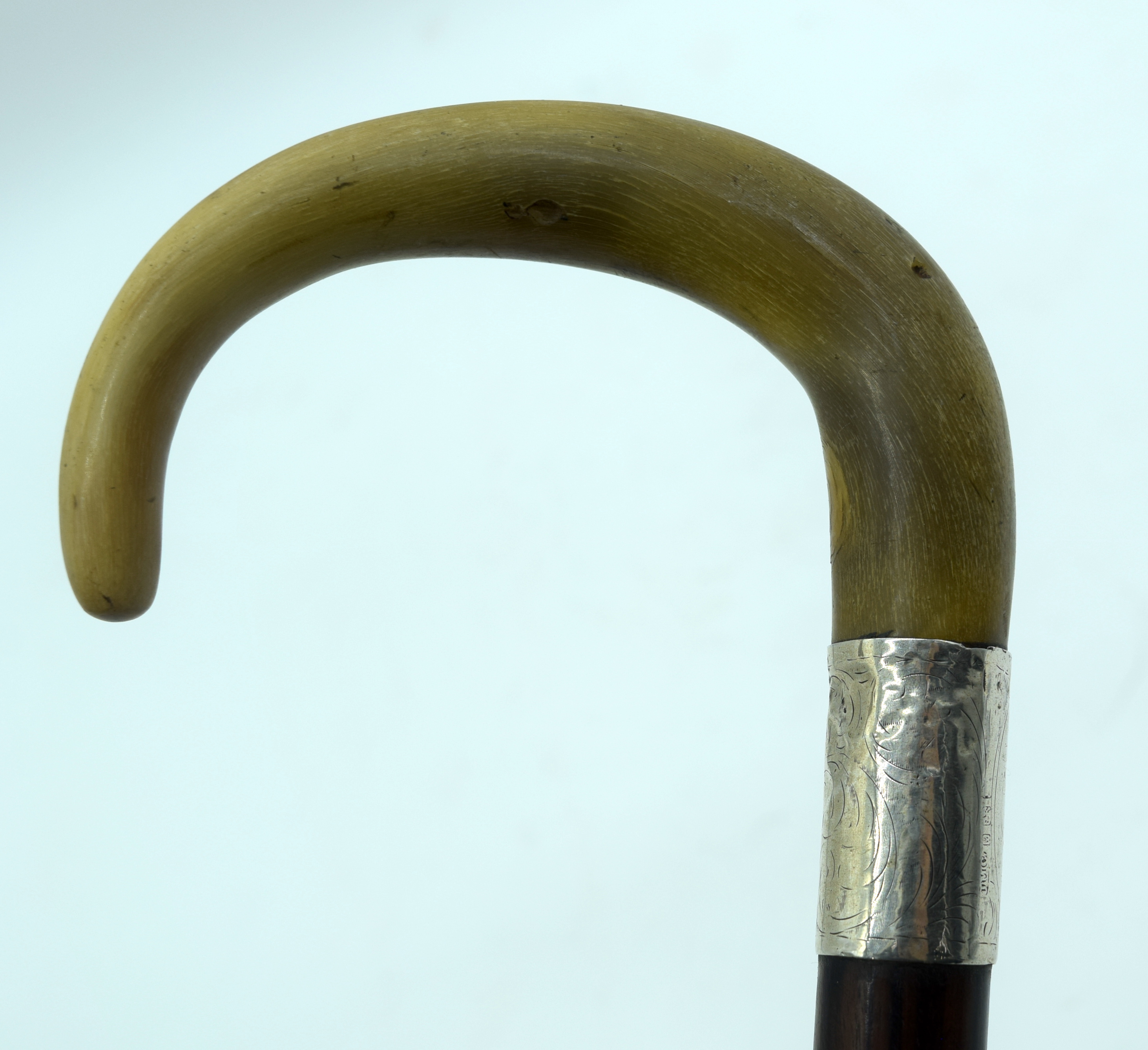 A 19TH CENTURY MIDDLE EASTERN CARVED RHINOCEROS HORN HANDLED WALKING CANE. 90 cm long.