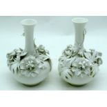 A PAIR OF 19TH CENTURY DERBY STEVENS & HANCOCK PORCELAIN VASES overlaid with flowers. 16 cm high.