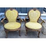 A GOOD PAIR OF 18TH/19TH CENTURY CONTINENTAL GILTWOOD SALON CHAIRS with scrolling acanthus capped ar