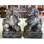 A PAIR OF 19TH CENTURY CHINESE CARVED SOAPSTONE BUDDHISTIC LIONS modelled upon square bases. 18 cm x