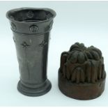 AN ARTS AND CRAFTS HAMPDEN PEWTER VASE decorated with floral roundels, together with a Victorian cop