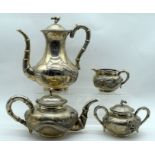 A LATE 19TH CENTURY CHINESE SHANGHAI EXPORT FOUR PIECE SILVER COFFEE SET decorated with dragons in v