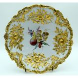 A LARGE ANTIQUE MEISSEN PORCELAIN SCALLOPED DISH painted with floral sprays, the border moulded with