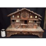 A RARE LARGE 19TH CENTURY BAVARIAN BLACK FOREST CARVED WOOD CUCKOO CLOCK modelled as a chalet upon a