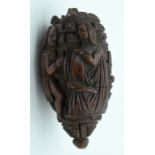 AN 18TH/19TH CENTURY FRENCH CARVED COQUILLA NUT SNUFF BOTTLE formed with figures in various pursuits