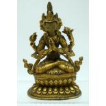 A 19TH CENTURY CHINESE SINO TIBETAN GILT BRONZE FIGURE OF A BUDDHISTIC DEITY modelled with hands cla