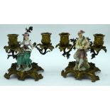 A RARE PAIR OF 18TH CENTURY EUROPEAN PORCELAIN FIGURES upon scrolling ormolu bases, one painted with