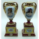 A PAIR OF EARLY 20TH CENTURY AUSTRIAN TWIN HANDLED PORCELAIN VASES Vienna style, decorated with pret