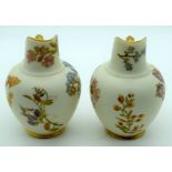 A PAIR OF ROYAL WORCESTER BLUSH IVORY FLATBACK JUGS painted with flowers. 13 cm high.