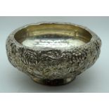 A 19TH CENTURY JAPANESE MEIJI PERIOD EMBOSSED SILVER BOWL decorated with flowers and vines. 720 gram