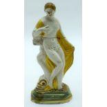 A LATE 18TH CENTURY ENGLISH CREAMWARE POTTERY FIGURE OF A FEMALE modelled standing upon a swan. 15 c