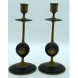 A PAIR OF 19TH CENTURY FRENCH BRASS CANDLESTICKS decorated with portraits. 27 cm high.