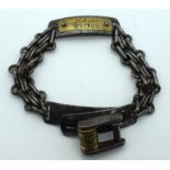 AN UNUSUAL EARLY 19TH CENTURY CONTINENTAL BRASS AND STEEL DOG COLLAR with applied brass plaque. 26 c
