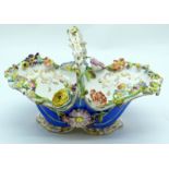 AN EARLY 19TH CENTURY ENGLISH PORCELAIN BASKET Attributed to Coakbrookdale, painted with floral spra