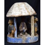 AN AFRICAN TRIBAL YORUBA PAINTED STOOL BASE and another. Largest 34 cm wide. (2)
