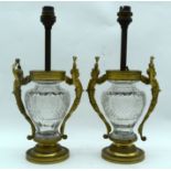 A PAIR OF MID 19TH CENTURY FRENCH ORMOLU AND CRYSTAL GLASS VASES converted to lamps, with caryatid h