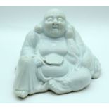 AN 18TH CENTURY CHINESE DEHUA BLANC DE CHINE PORCELAIN FIGURE OF A SEATED BUDDHA Qing, probably repr