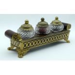 AN ENGLISH REGENCY BOULLE AND GILT METAL INKWELL decorated with geometric motifs upon cl