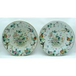 A LARGE PAIR OF 19TH CENTURY CHINESE CANTON FAMILLE ROSE PORCELAIN DISHES Qing, painted with flowers