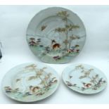 A RARE SET OF THREE LARGE 18TH CENTURY CHINESE EXPORT FAMILLE ROSE PORCELAIN DISHES Qianlong, painte