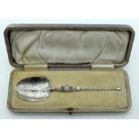 A CHARMING ARTS AND CRAFTS SILVER AND ENAMEL SILVER SPOON by Levi & Salaman, decorated with foliage