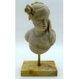 AN 18TH/19TH CENTURY EUROPEAN CARVED MARBLE BUST OF A FEMALE elegantly modelled upon a sienna marble