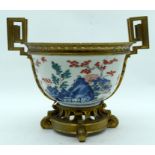 A GOOD 17TH/18TH CENTURY JAPANESE EDO PERIOD KAKIEMON BOWL with French ormolu mounts, painted with l