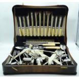 A CHARMING BOXED CANTEEN OF SILVER PLATED CUTLERY. (qty)