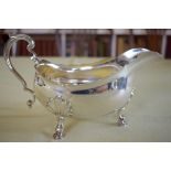 A GEORGE III STYLE SILVER SAUCE BOAT Retailed by Tessiers of London. London 1963. 355 grams. 22 cm x