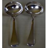 A PAIR OF GEORGE III SILVER LADLES. London 1806. 92 grams. 15 grams.