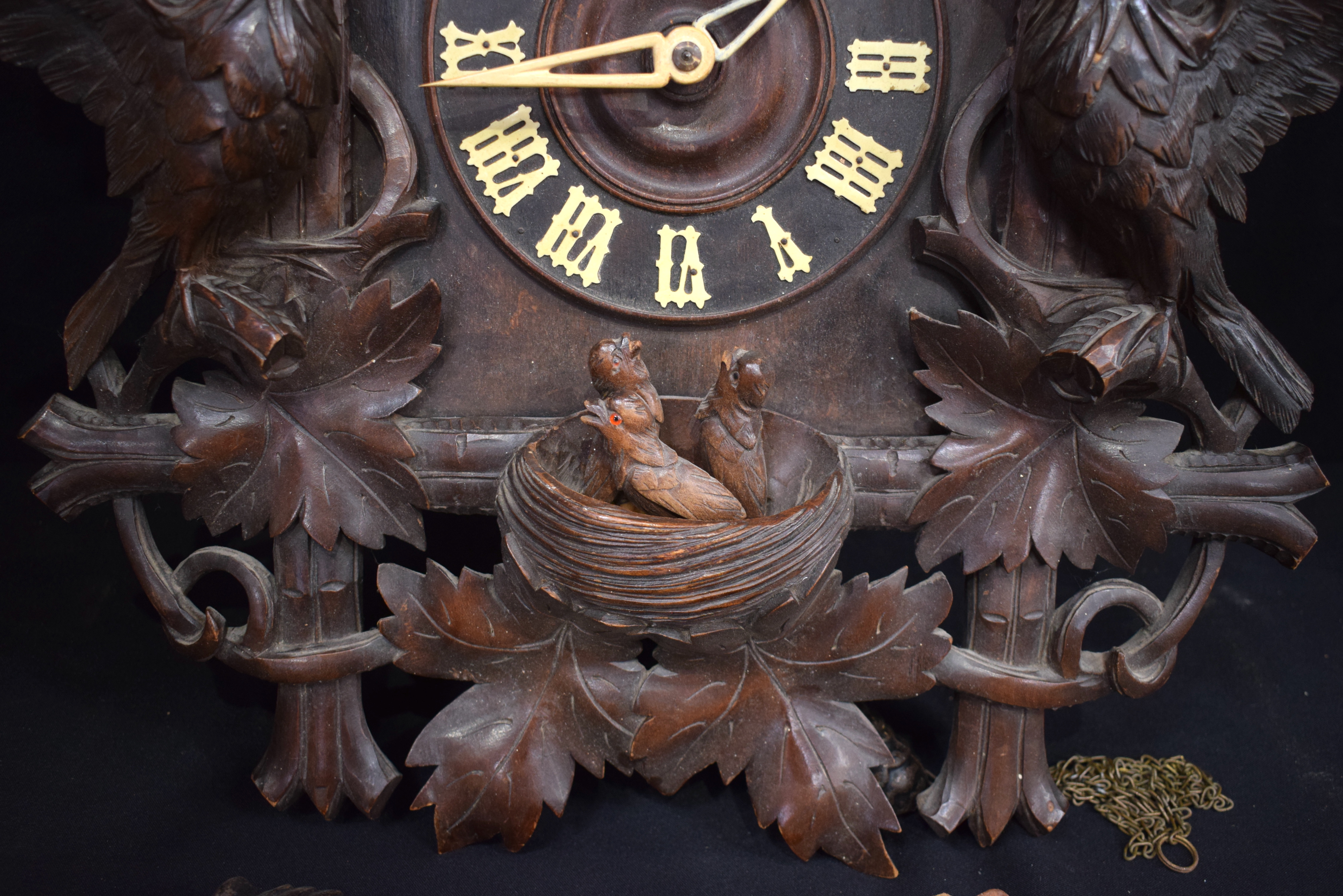 A 19TH CENTURY BAVARIAN BLACK FOREST CARVED WOOD CUCKOO CLOCK formed with opposing birds beside a ne - Image 9 of 13