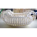 AN ANTIQUE CONTINENTAL CREAMWARE STYLE CHINA BASKET modelled in the style of Leeds. 22 cm x 10 cm.