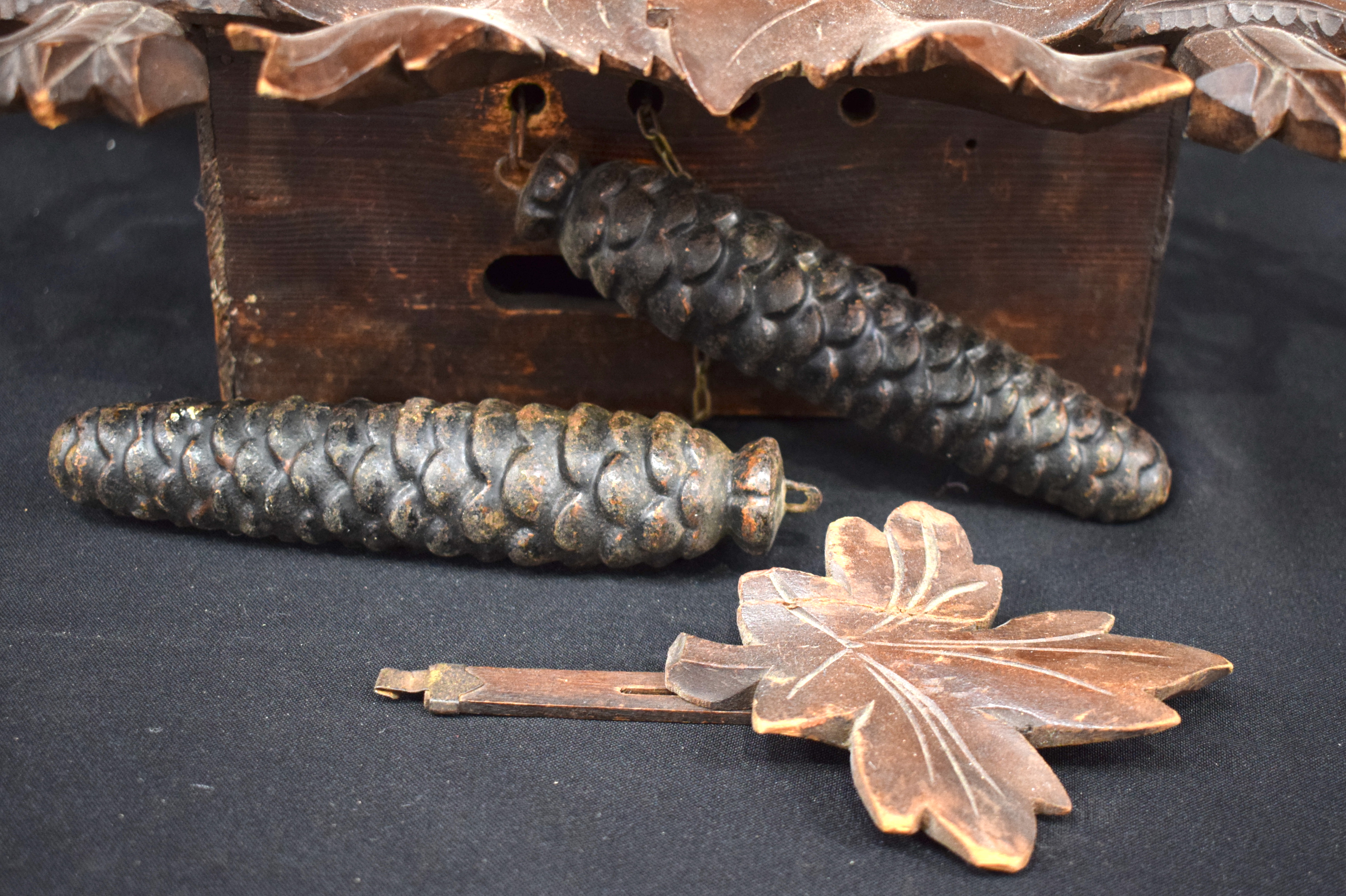 A 19TH CENTURY BAVARIAN BLACK FOREST CARVED WOOD CUCKOO CLOCK formed with opposing birds beside a ne - Image 10 of 13