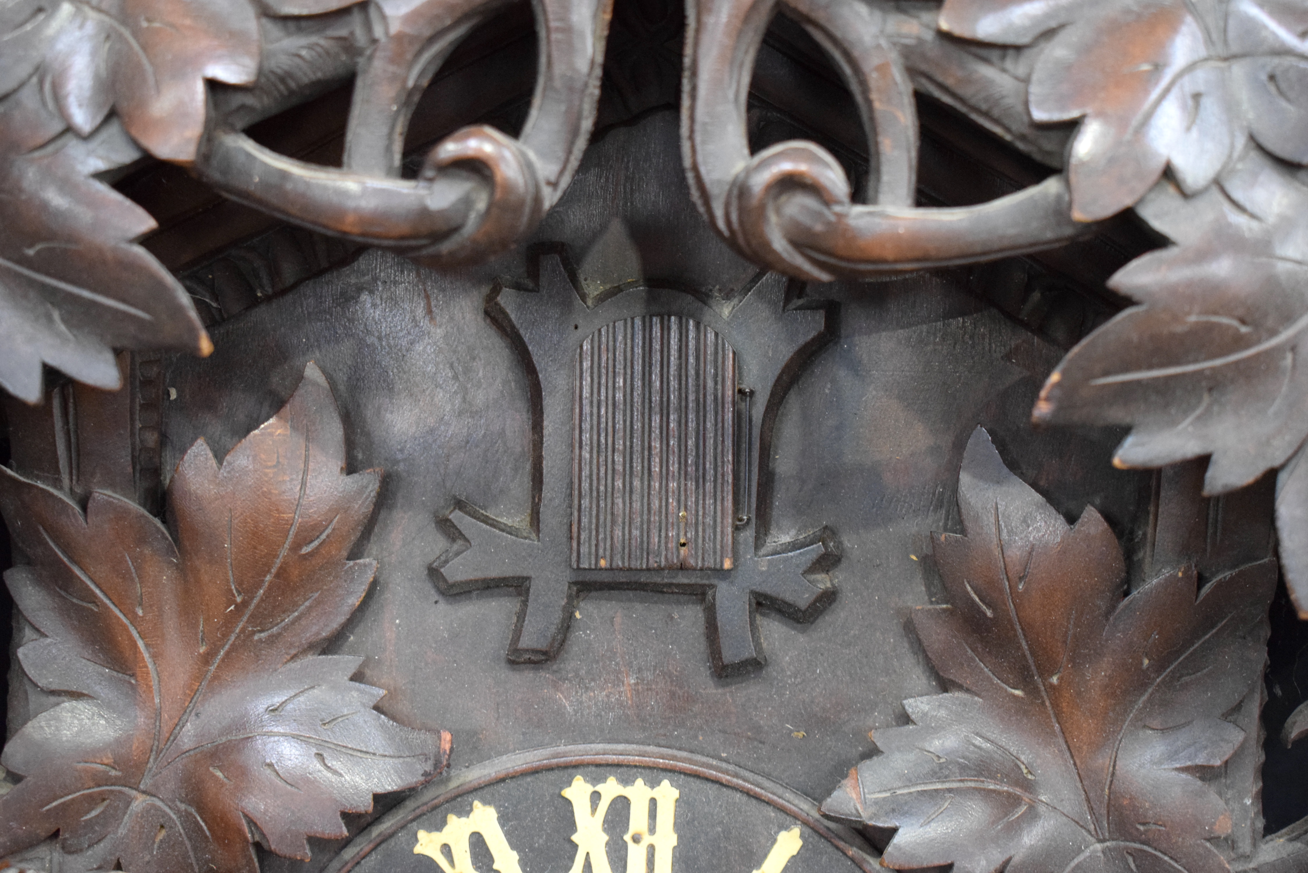 A 19TH CENTURY BAVARIAN BLACK FOREST CARVED WOOD CUCKOO CLOCK formed with opposing birds beside a ne - Image 5 of 13