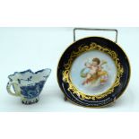 AN 18TH CENTURY ENGLISH BLUE AND WHITE PORCELAIN CREAM BOAT Bow or Derby, together with a Sevres por