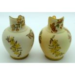 A PAIR OF ROYAL WORCESTER BLUSH IVORY FLATBACK JUGS C1896 painted with flowers. 15 cm high.
