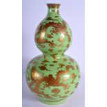 A VERY RARE CHINESE DOUBLE GOURD DRAGON VASE with golden cloud and dragion design on green ground.