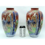 A LARGE PAIR OF 19TH CENTURY JAPANESE MEIJI PERIOD KUTANI VASES painted with figures within landscap