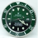 A contemporary Rolex type wall clock 34cm.