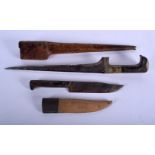 TWO 19TH CENTURY MIDDLE EASTERN CARVED RHINOCEROS HORN KNIVES. Largest 37 cm long. (2)