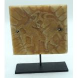 A South East Asian carved Alabaster tablet on a stand 14 x 16cm (2)